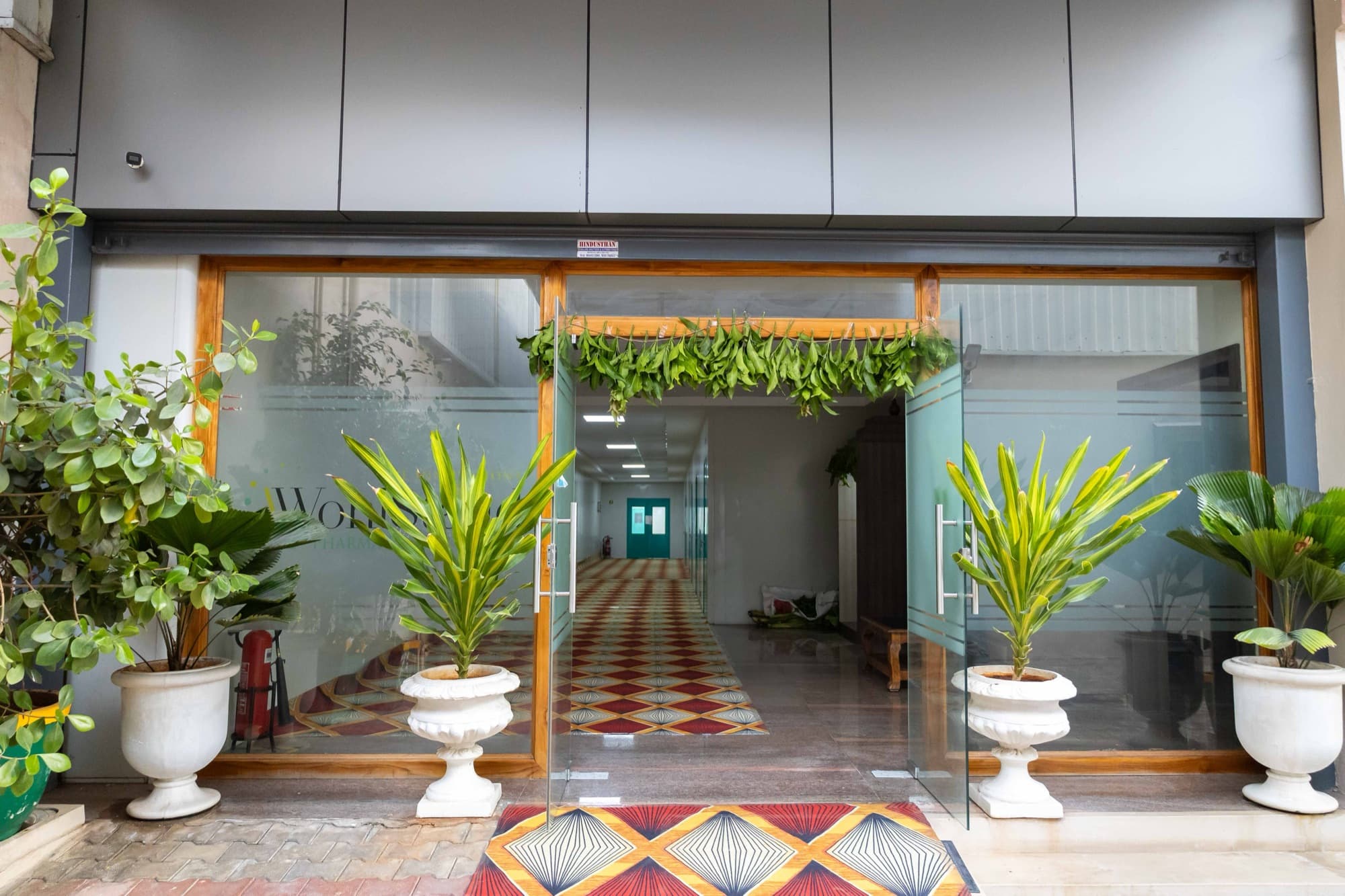 Glass entrance doors opening onto the facility corridor